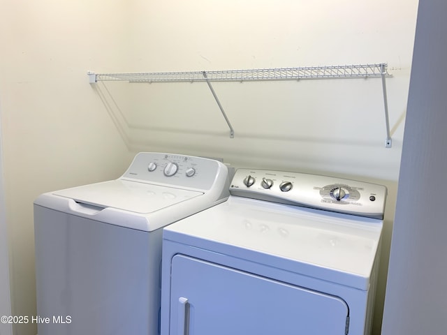 washroom featuring independent washer and dryer