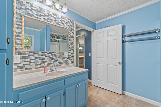 bathroom with ornamental molding, vanity, a textured ceiling, and backsplash