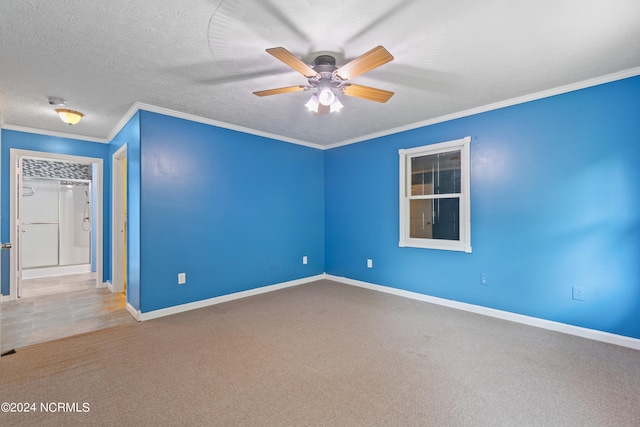 carpeted empty room with crown molding, ceiling fan, and a textured ceiling