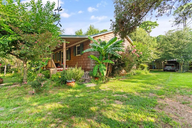 view of yard featuring a carport