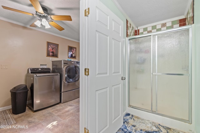 laundry area with ceiling fan, crown molding, washer and clothes dryer, and a textured ceiling