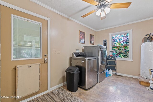 clothes washing area featuring ornamental molding, separate washer and dryer, and ceiling fan