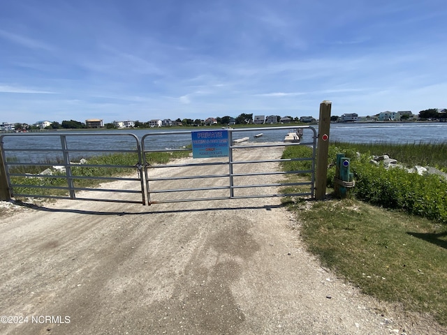 view of gate featuring a water view