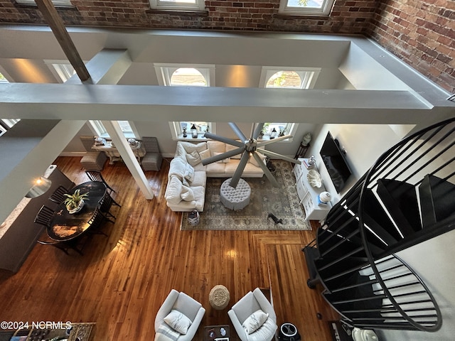 unfurnished living room with brick wall