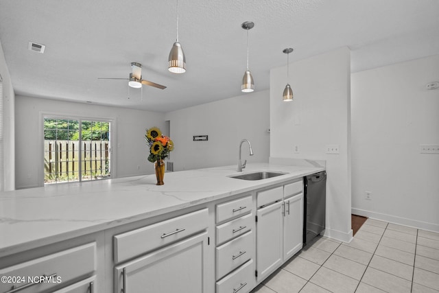 kitchen featuring light stone counters, ceiling fan, sink, dishwasher, and white cabinetry