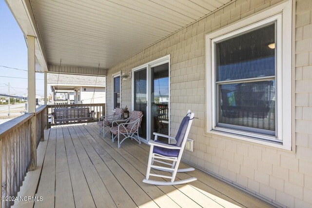 wooden deck featuring a porch