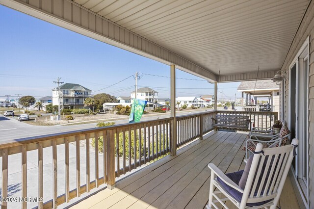 wooden terrace featuring a porch