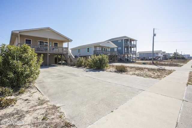 coastal home featuring a carport and a porch