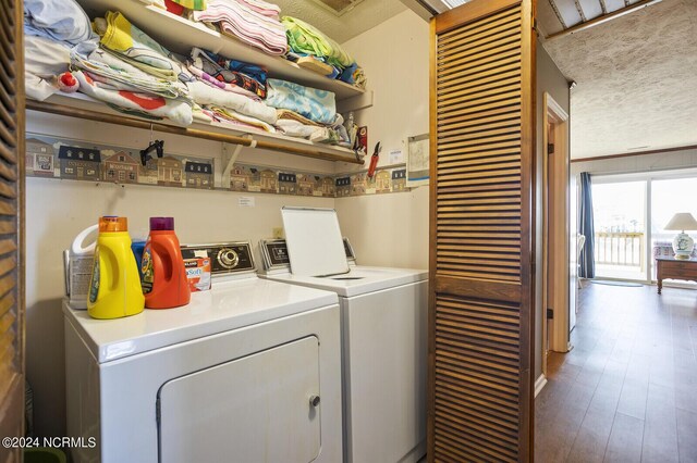 washroom featuring separate washer and dryer and hardwood / wood-style flooring