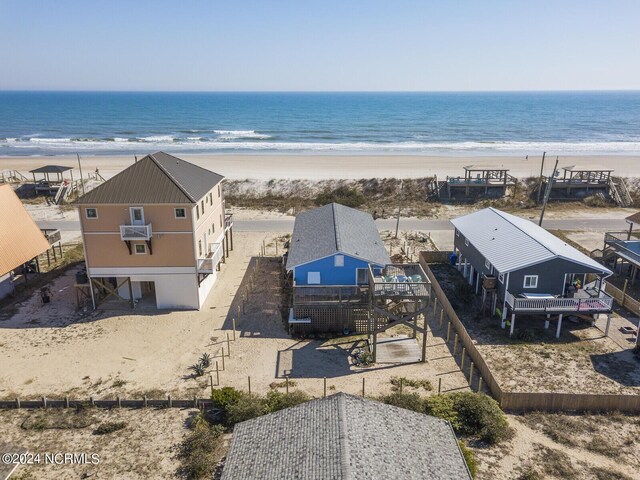 birds eye view of property featuring a water view and a view of the beach