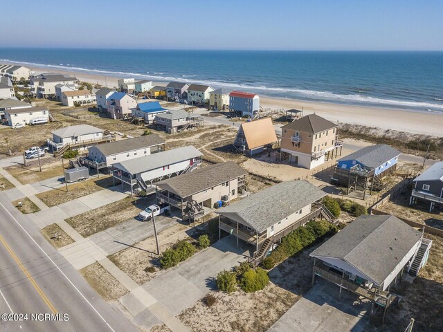 bird's eye view with a beach view and a water view