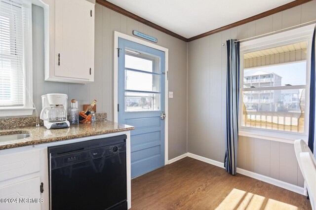 kitchen with light wood-type flooring, black dishwasher, white cabinetry, and ornamental molding