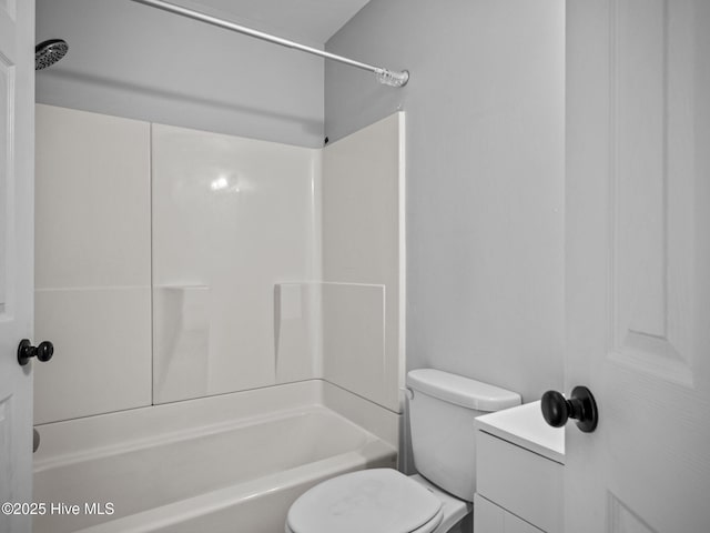 full bathroom with shower / bath combination, vanity, and toilet