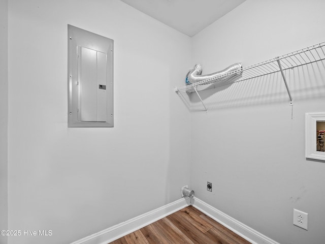 laundry area featuring hardwood / wood-style flooring, electric dryer hookup, washer hookup, and electric panel