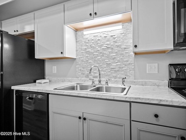 kitchen with white cabinets, sink, and black appliances