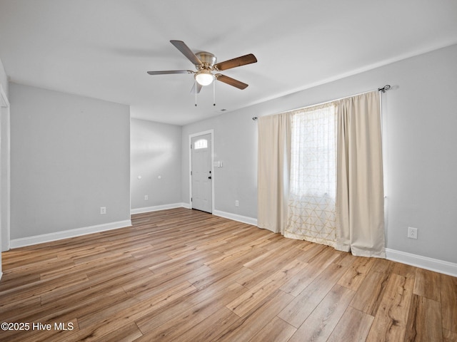 spare room with ceiling fan and light hardwood / wood-style floors