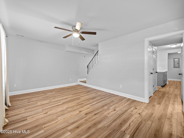 spare room featuring ceiling fan and light hardwood / wood-style floors