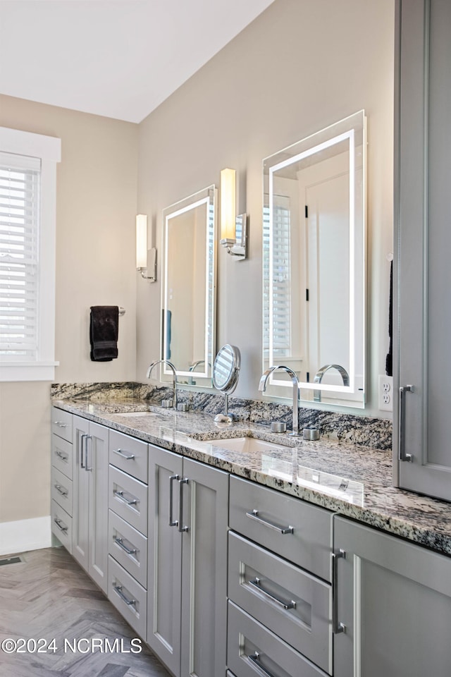 bathroom with dual vanity