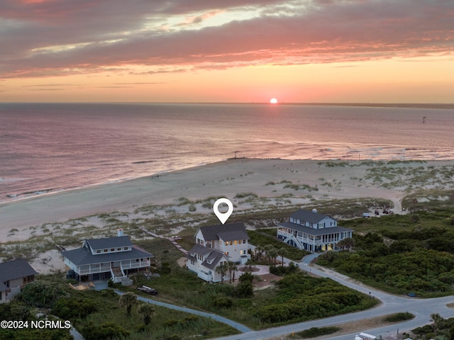 aerial view at dusk with a water view