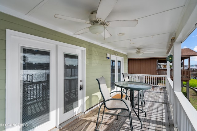 wooden terrace with french doors and ceiling fan