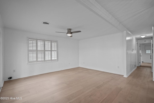 empty room featuring ceiling fan and light wood-type flooring