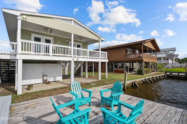 exterior space featuring a deck with water view