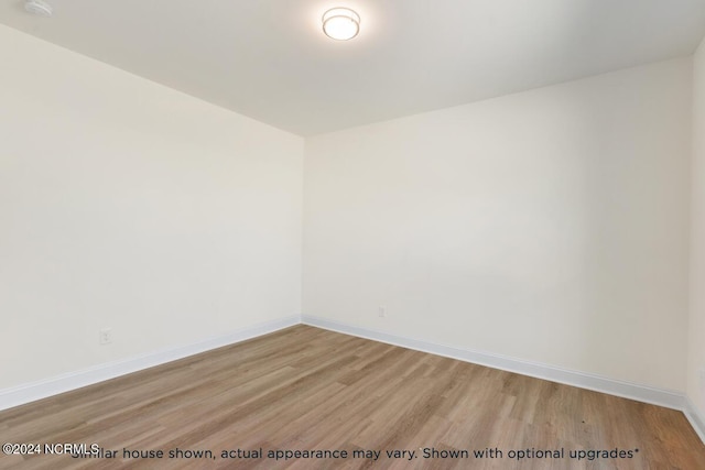 unfurnished room with light hardwood / wood-style flooring