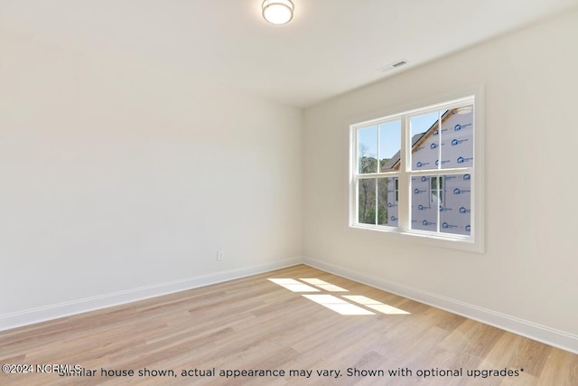 unfurnished room featuring light wood-type flooring