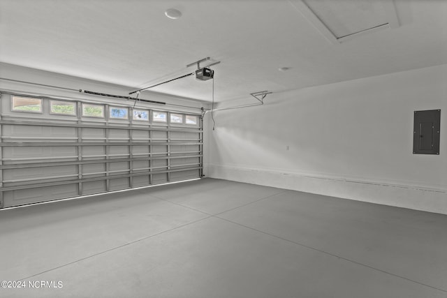 garage featuring a garage door opener and electric panel