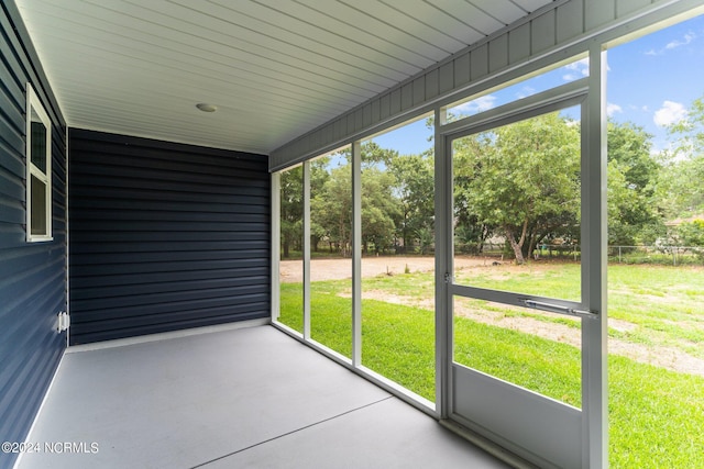 unfurnished sunroom featuring a wealth of natural light