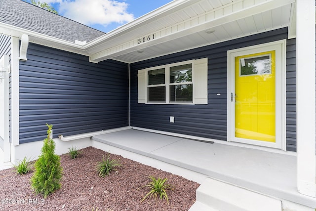 doorway to property featuring a porch