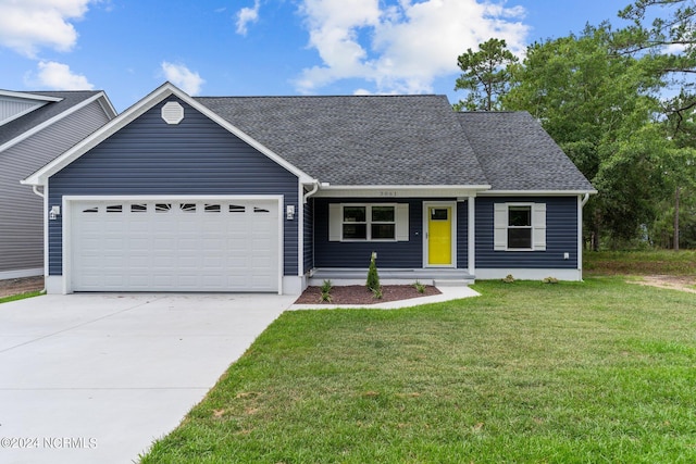 view of front facade featuring a garage and a front lawn