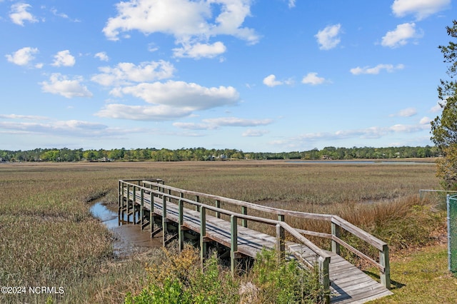 view of dock with a rural view