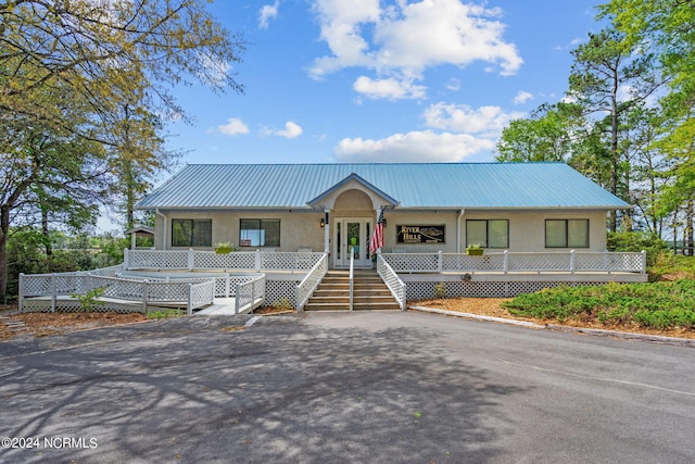 view of front of property featuring a porch and french doors