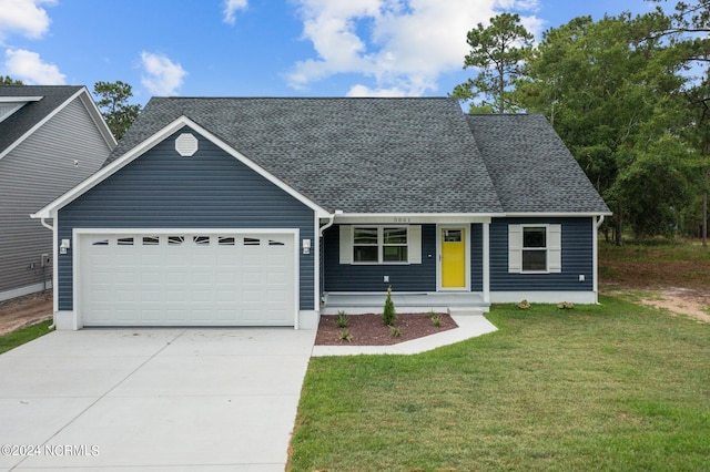 view of front of house featuring a porch, a garage, and a front yard