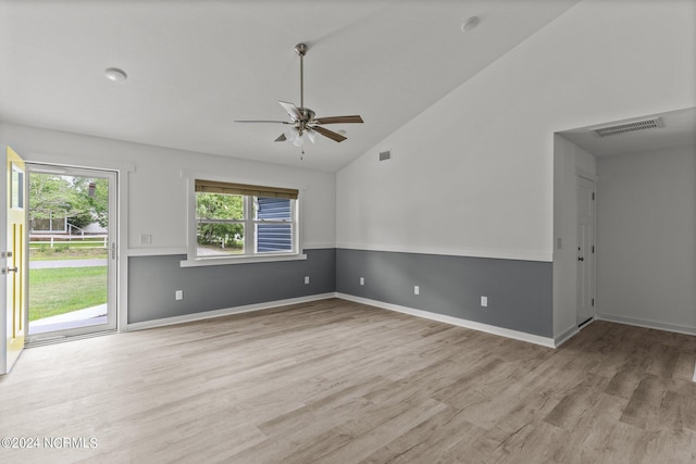 unfurnished room with ceiling fan, vaulted ceiling, and light hardwood / wood-style flooring