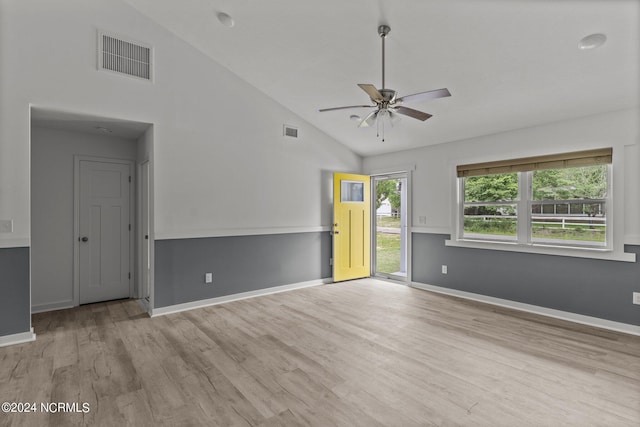 unfurnished room with ceiling fan, high vaulted ceiling, and light hardwood / wood-style floors