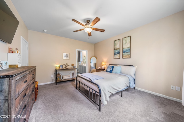 carpeted bedroom with a ceiling fan and baseboards