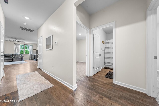 hallway featuring dark wood-type flooring