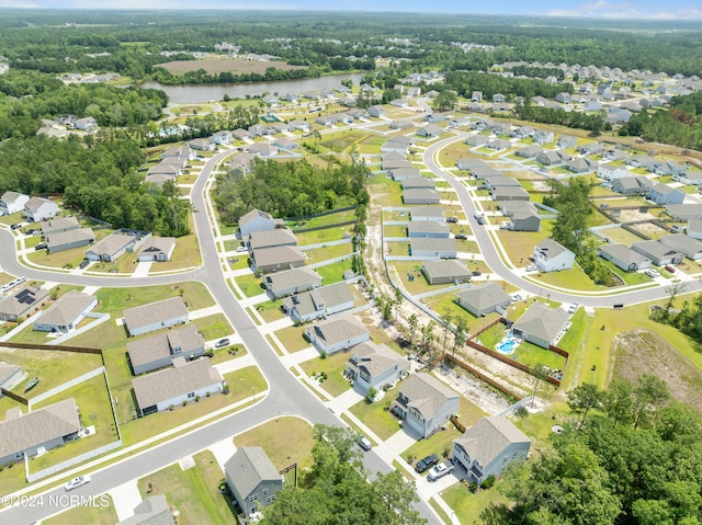 drone / aerial view featuring a residential view and a water view