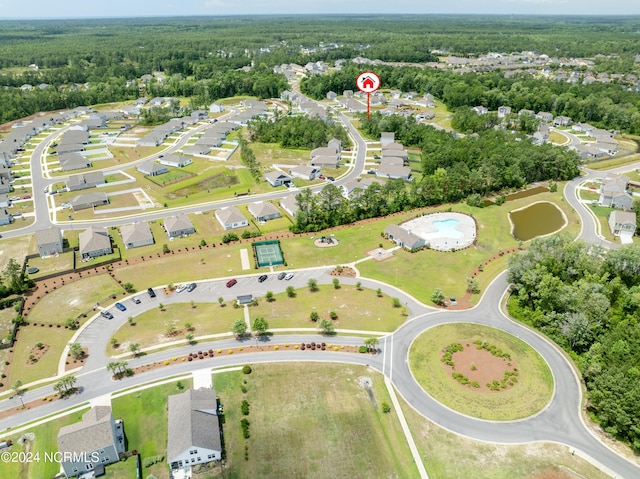 drone / aerial view with a view of trees and a residential view