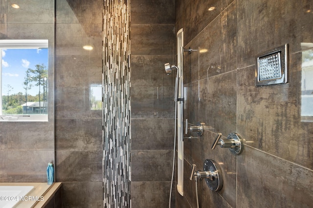 bathroom with tiled shower