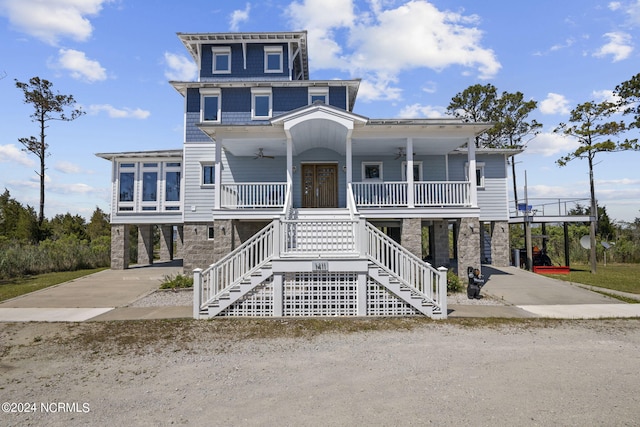 coastal home featuring a carport and covered porch