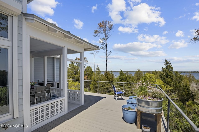 deck featuring a water view