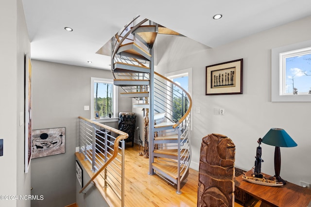 stairway featuring wood-type flooring