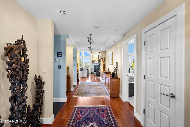 corridor featuring dark wood-type flooring