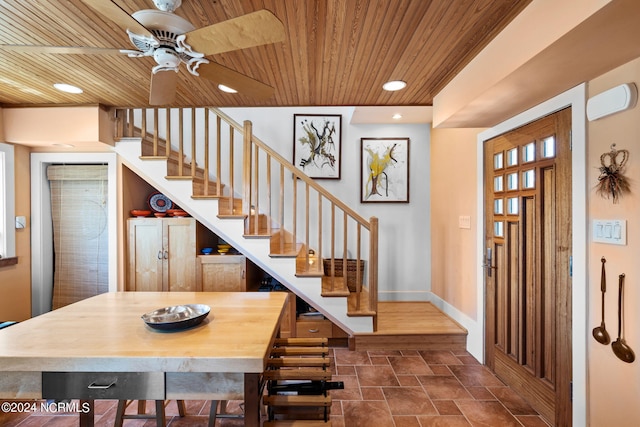 entrance foyer featuring ceiling fan and wood ceiling