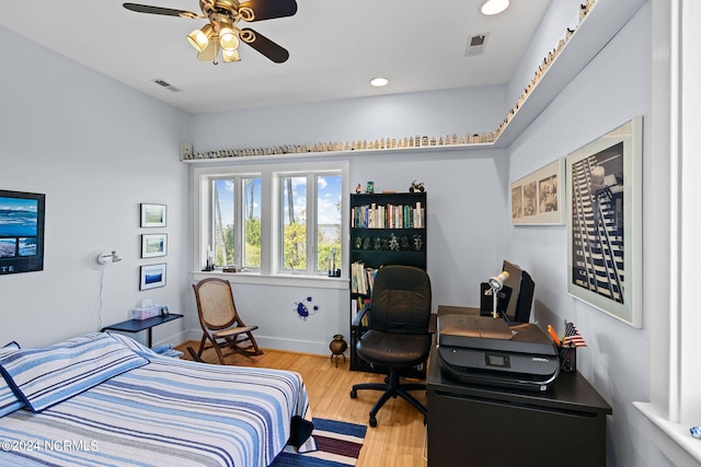 bedroom featuring wood-type flooring and ceiling fan