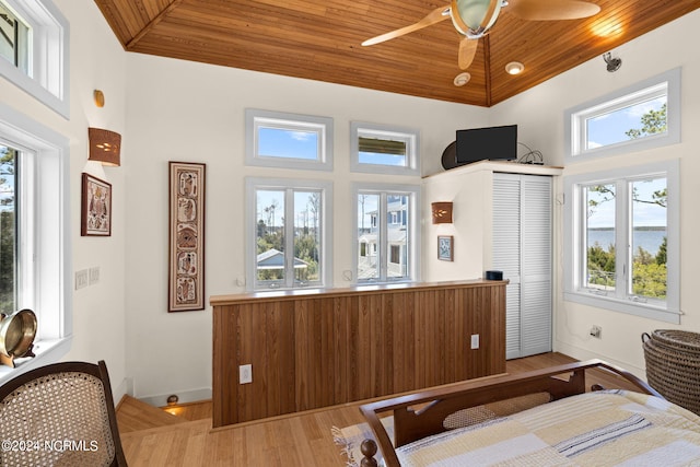 bedroom with multiple windows, ceiling fan, and wooden ceiling