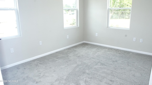 unfurnished room with carpet floors